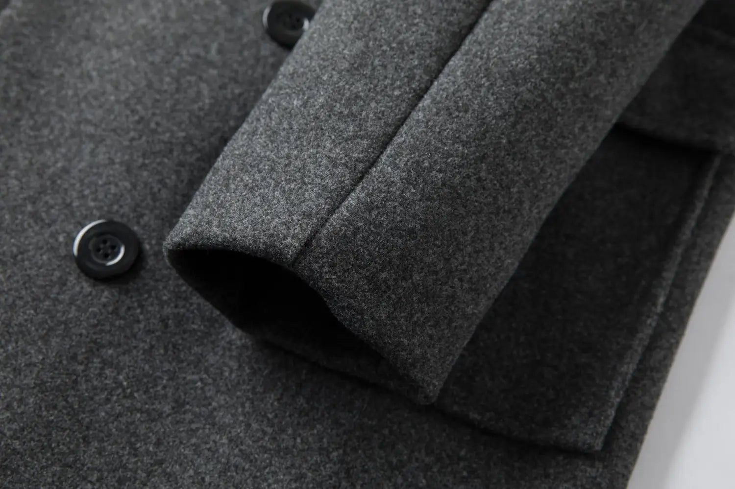 Men double breasted dark gray wool overcoat with black buttons and mid length design.