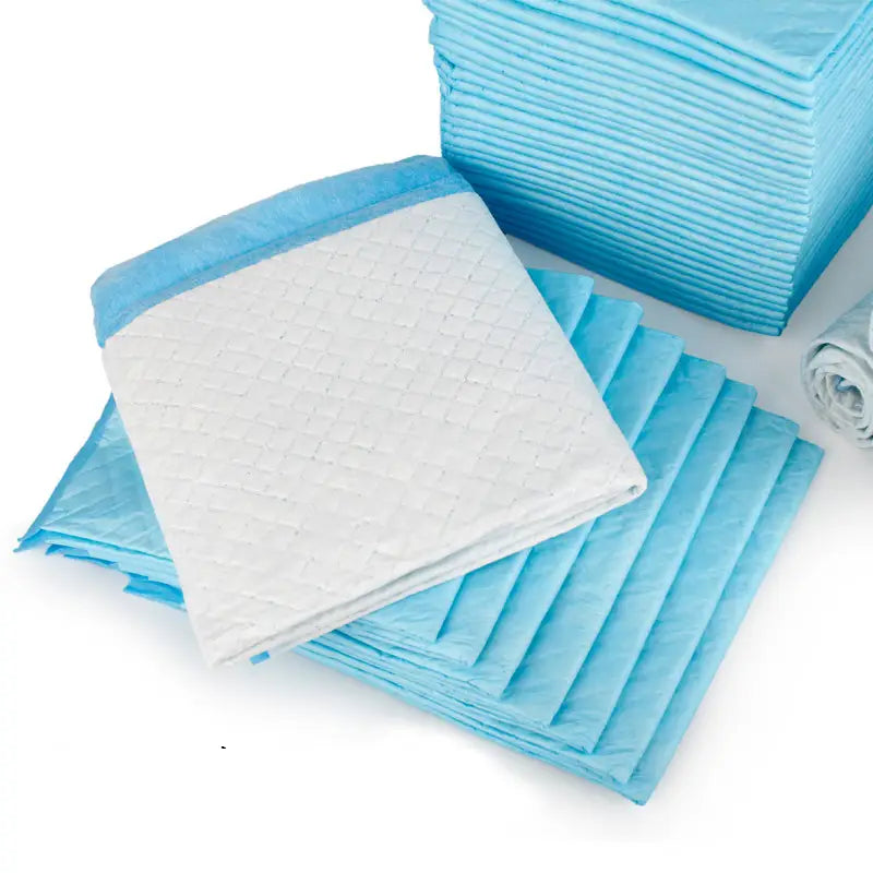 Light blue and white disposable dog pee pads with thickening absorbent quilted texture for pet training mats.