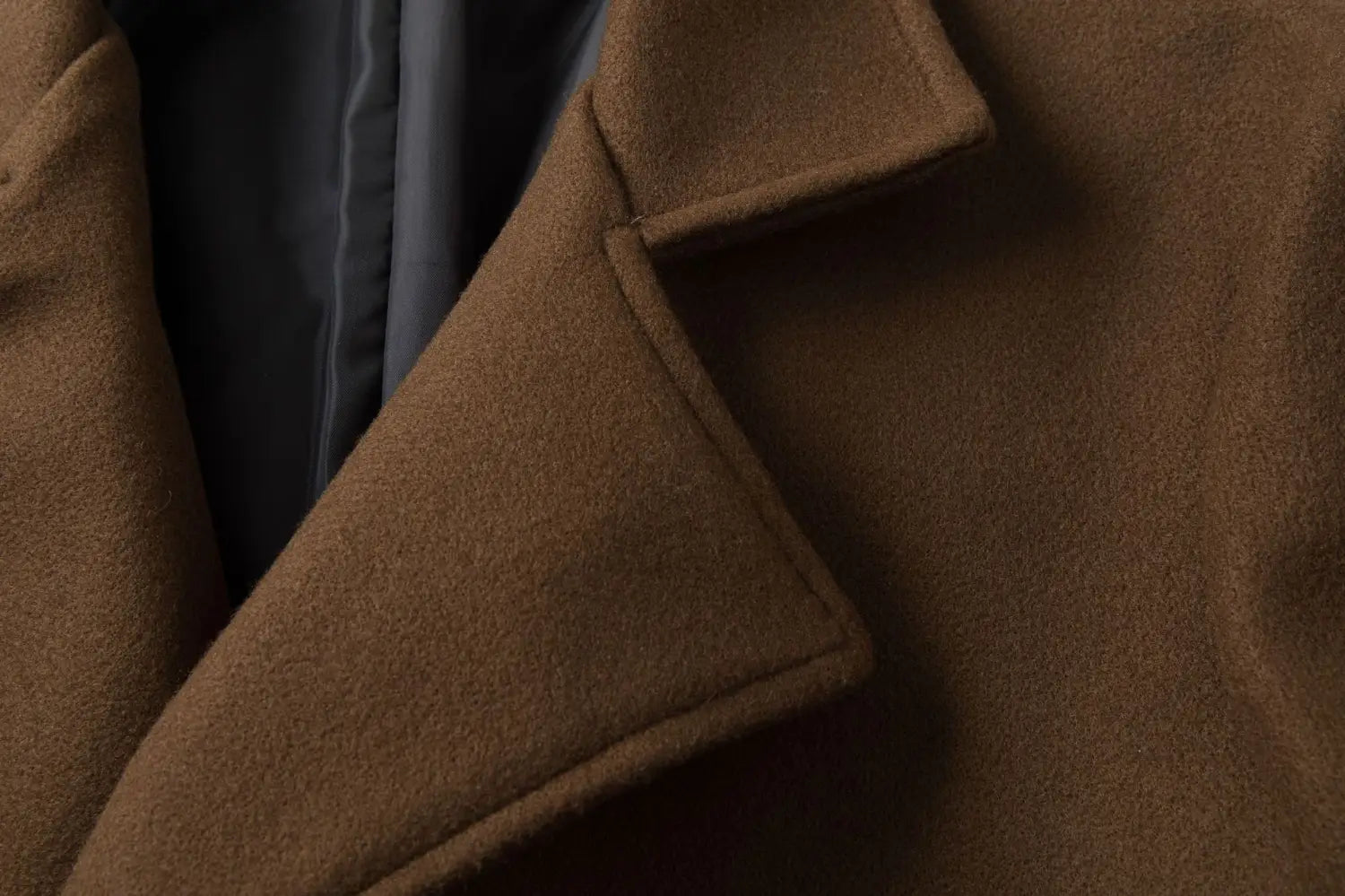 Men double breasted wool overcoat in rich brown featuring a classic notched collar and tailored seams.