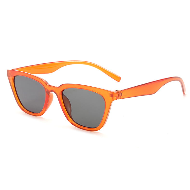 vintage cat eye sunglasses featuring orange translucent acetate frames with gray lenses.