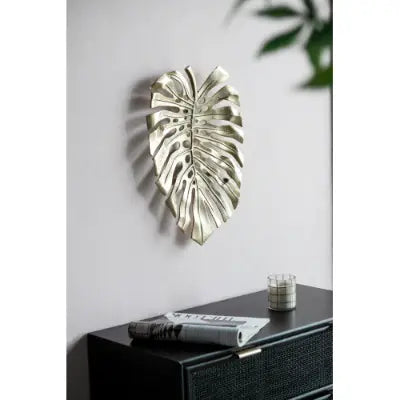 Silver monstera leaf wall decor featuring a textured metallic finish as part of a gold monstera leaf wall decor and serving tray collection.