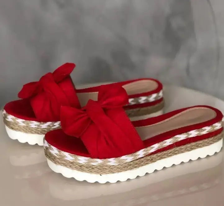 Women platform bow espadrille slide sandals in red velvet with a woven rope and white trim sole.