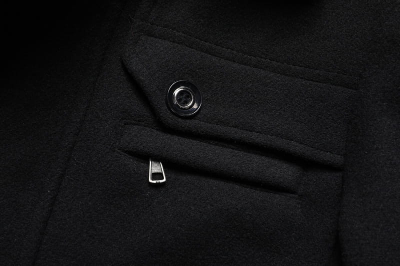 black wool winter overcoat with silver-toned button and zipper pull designed as a quilted jacket for men
