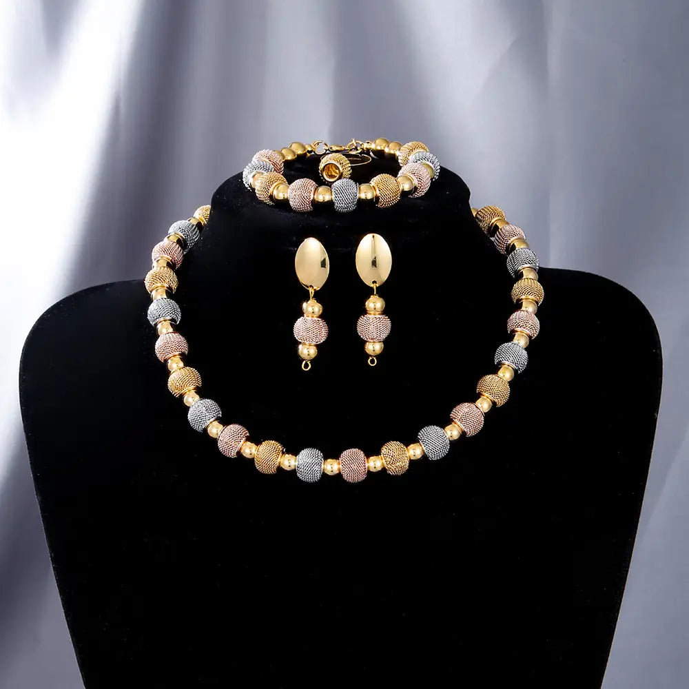 5-piece tri-tone metallic beaded jewelry set featuring gold silver and rose gold textured spherical beads.