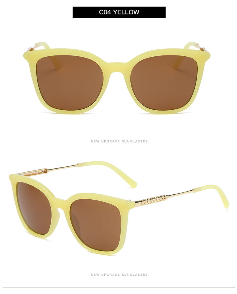Vintage cat eye sunglasses featuring yellow frames, brown lenses, and gold-tone chain detailing on the temples.