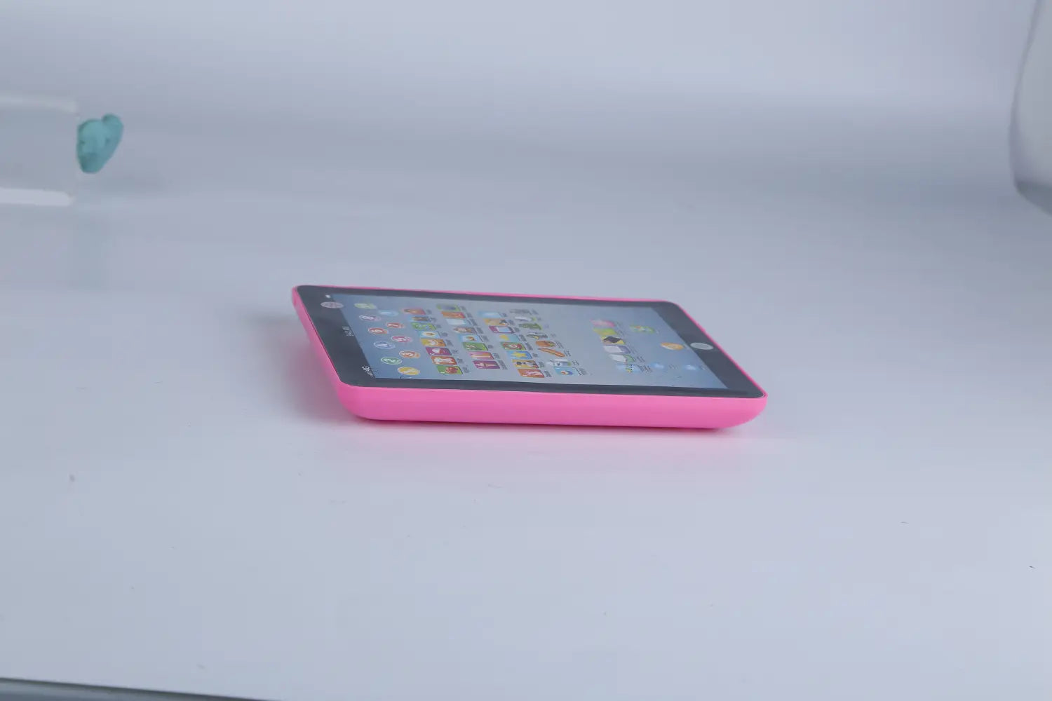 a pink baby learning tablet educational toy for toddlers with a vibrant glossy finish and rounded edges