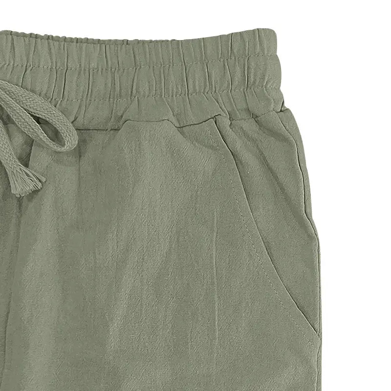 Men’s olive green linen joggers with a soft textured fabric and elastic waistband casual drawstring pants.