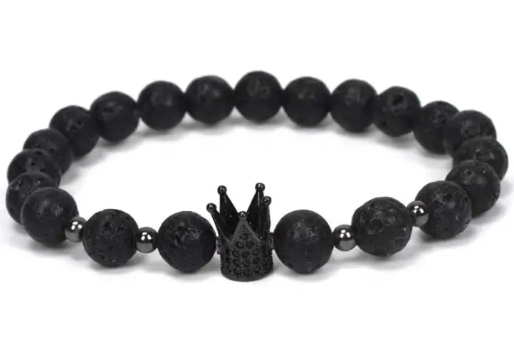 Black lava stone bead bracelet featuring a black crown charm as part of the natural lapis lazuli and lava stone owl charm bracelet collection.
