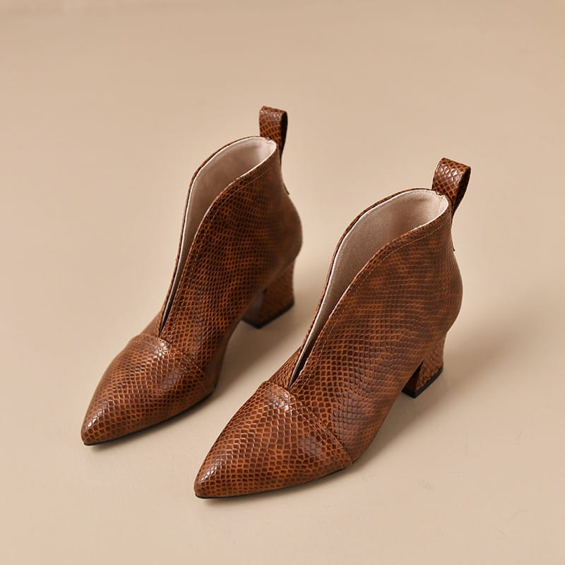 Brown snakeskin textured ankle boots with a v cut pointed toe and low block heel.