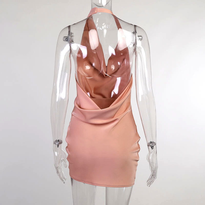 A sleek blush-pink satin halter mini party dress featuring a draped neckline and fitted silhouette.