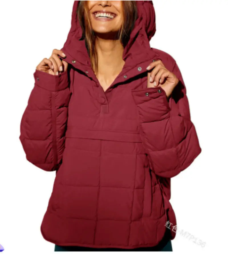 A cozy maroon quilted hooded puffer jacket for women with a warm insulated design.