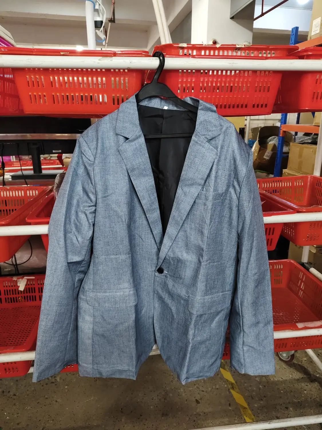 Mens slim fit casual blazer british style suit in light blue textured fabric with a single black button and two front pockets.