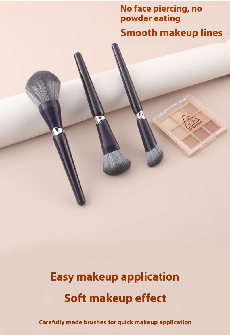 Set of three black-handled makeup brushes with silver accents and soft dense bristles designed as a face powder tool for makeup application.