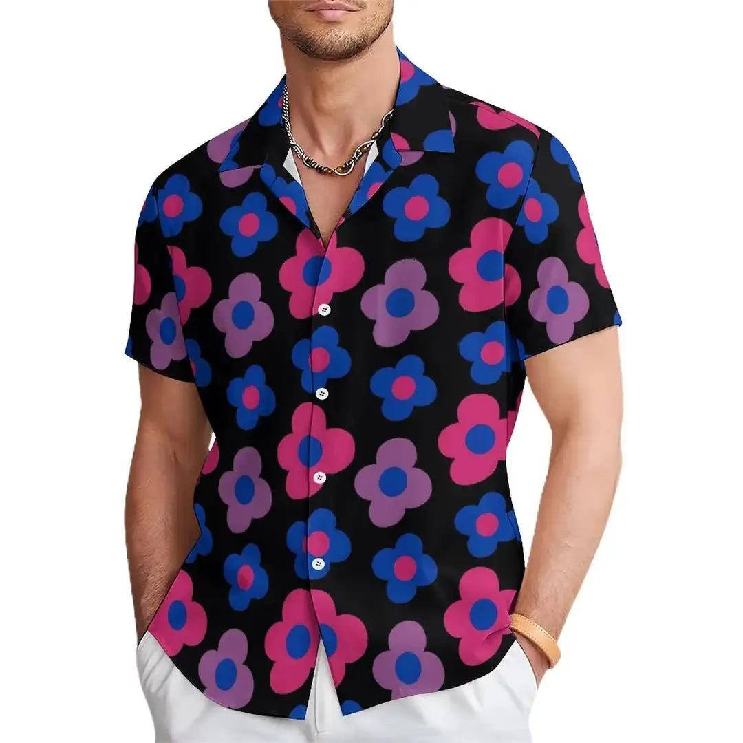 Men’s tropical surfing Bigfoot short sleeve Hawaiian shirt in black featuring a vibrant pattern of pink and blue flowers with purple outlines.
