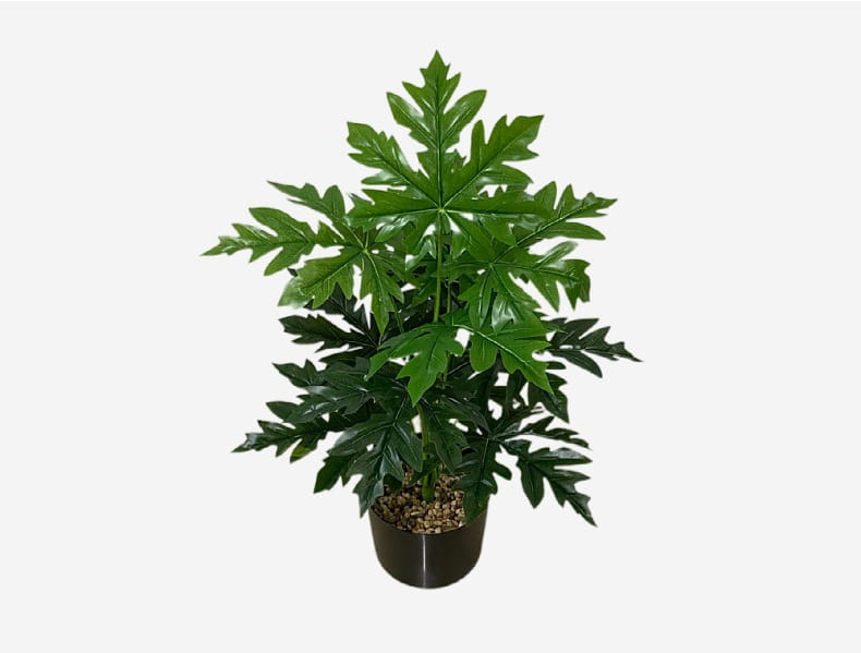 A lush artificial monstera turtle leaf plant with broad deeply lobed green leaves in a sleek black pot for garden decor.