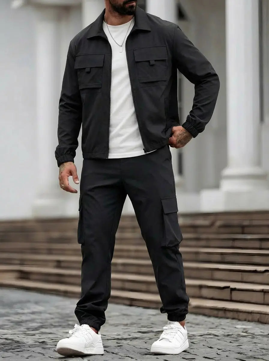 black utility zip up workwear jacket with two chest pockets and a collar worn over a white t-shirt for mens casual and durable outerwear