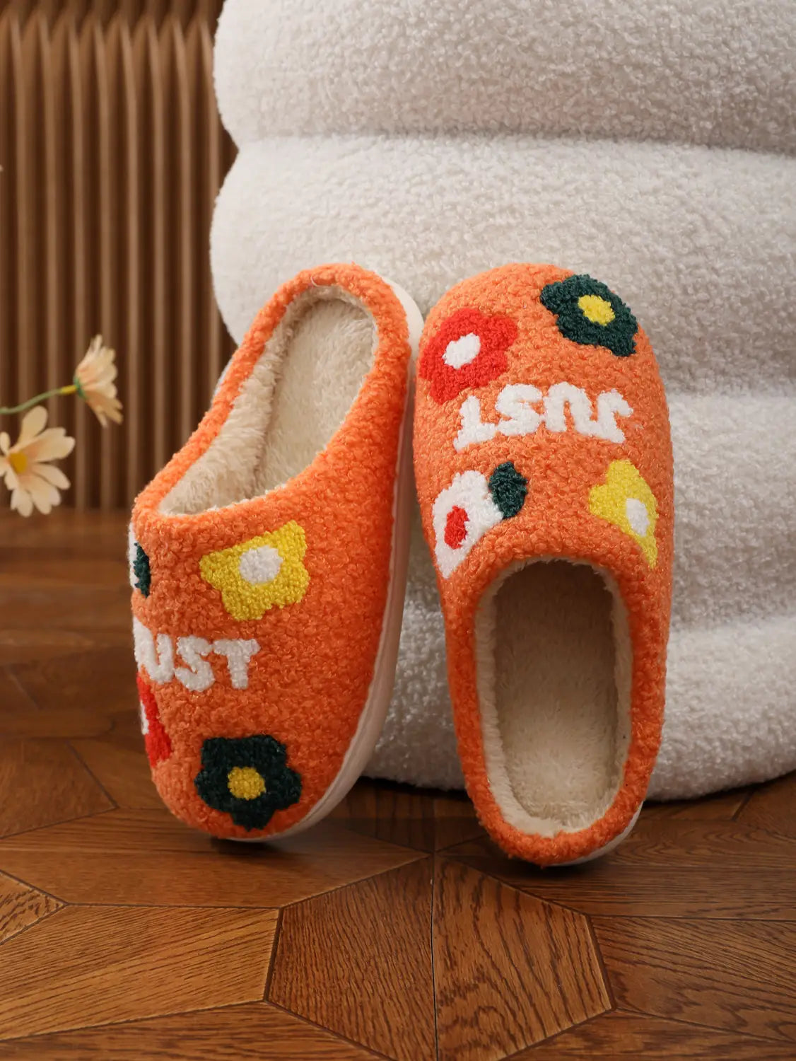 Orange plush floral cotton slip-on slippers with soft tpr sole featuring colorful embroidered flowers and white lettering just