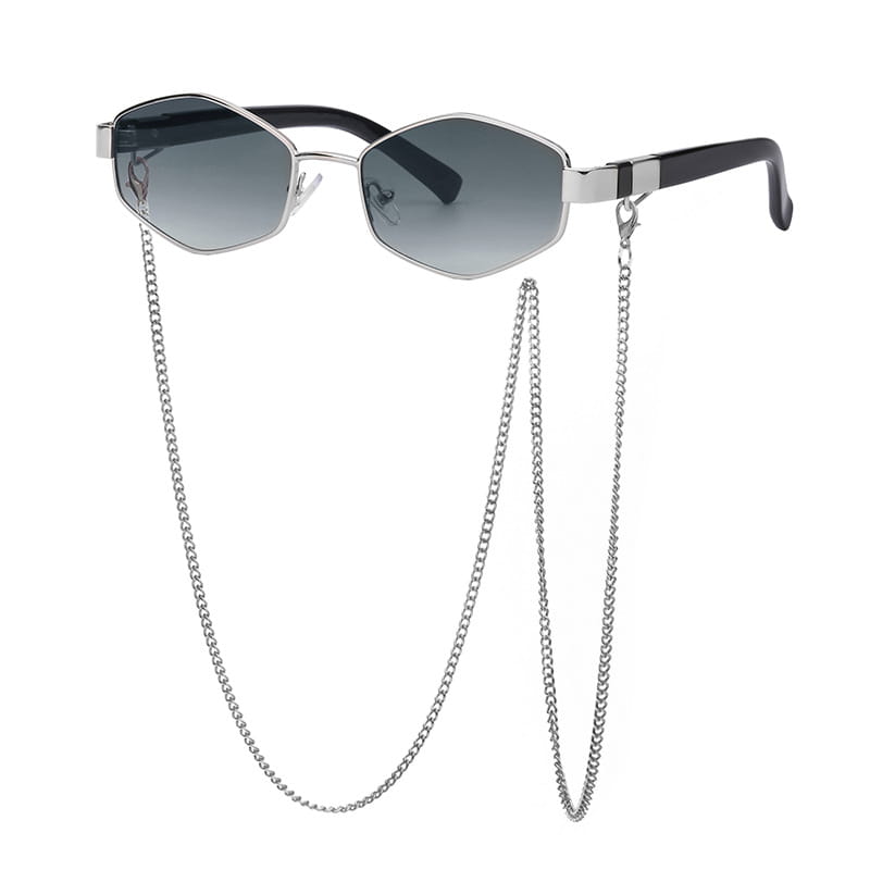 Silver-framed women’s octagonal sunglasses with gradient gray lenses, black temple tips, and a matching metal chain accent.
