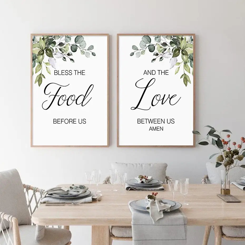 Two framed eucalyptus botanical love and bless wall art prints featuring elegant black cursive text on a white background in light wood frames.