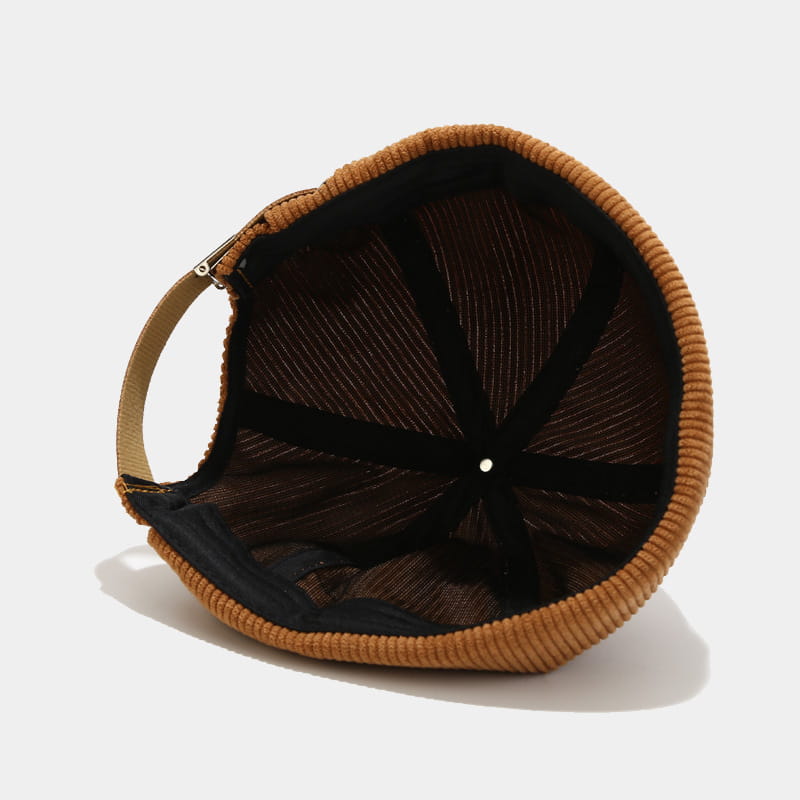 tan corduroy landlord beanie adjustable streetwear hat featuring a black mesh interior and adjustable strap shown from the back side