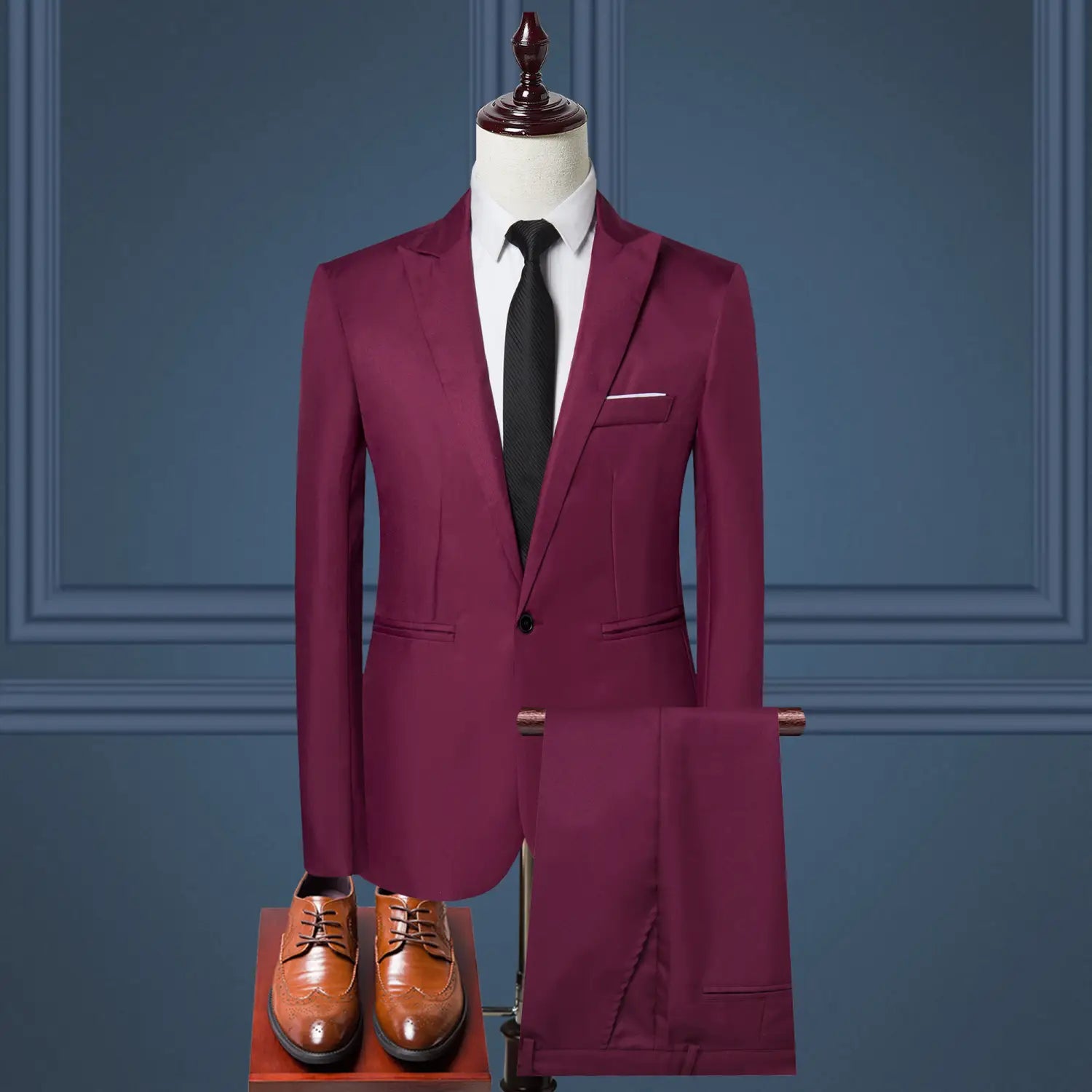 A sleek maroon men solid color two piece leisure suit with tailored fit and matching trousers.