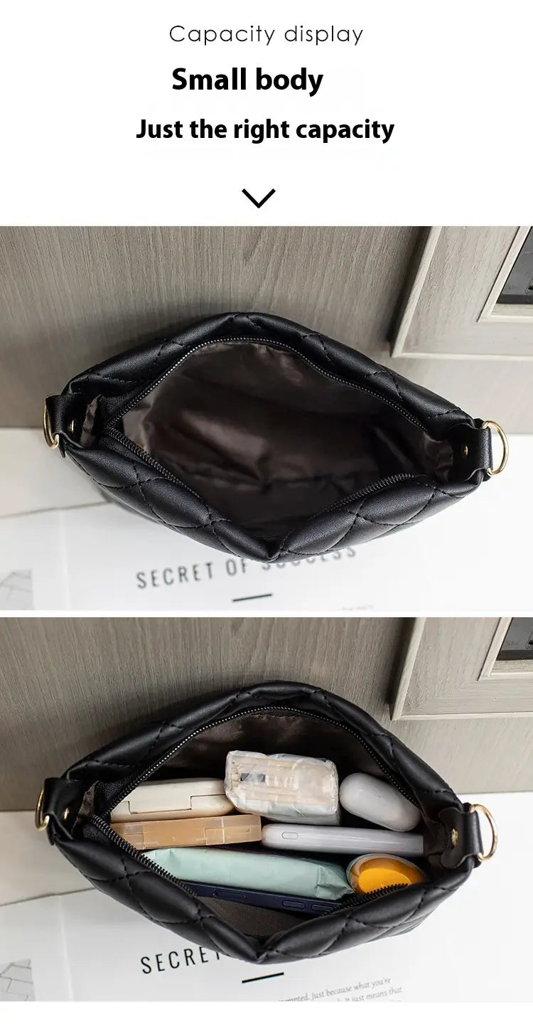 Black quilted leather crossbody bag with a compact design featuring a striped strap for versatile use.