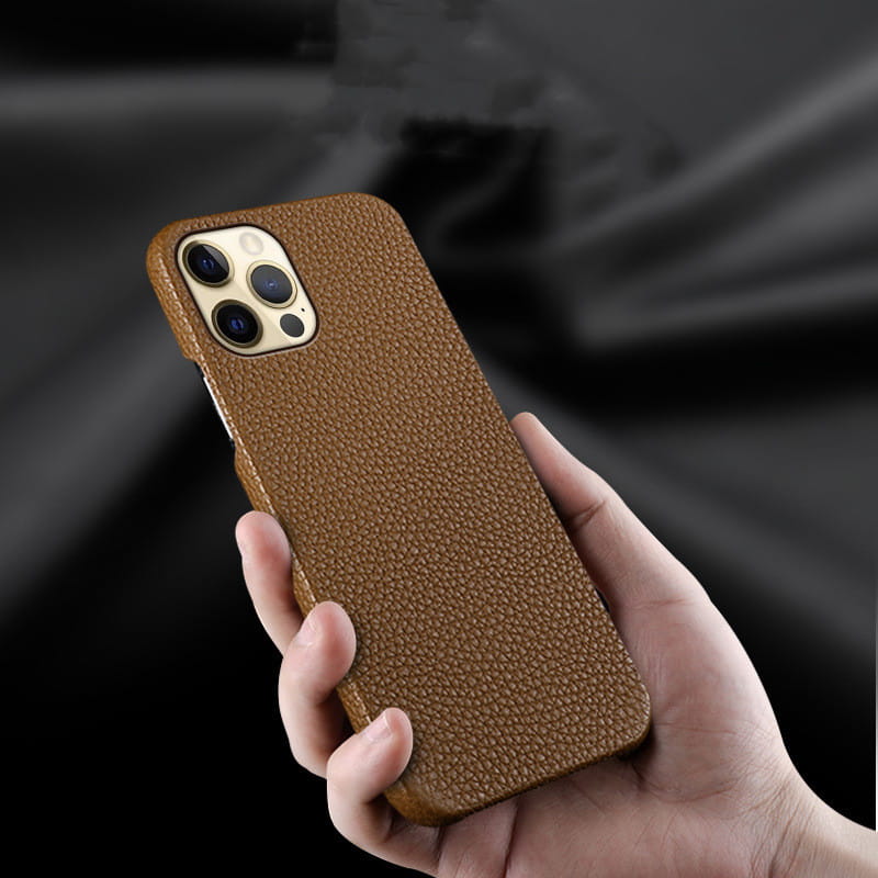 Brown textured genuine leather anti drop iPhone case showing the back side holding an iPhone for models 12 13 and 14.