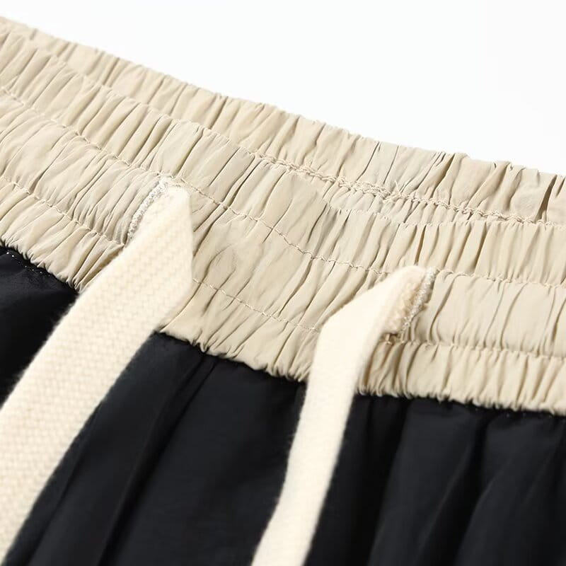 shorts en nylon décontractés pour hommes, coupe droite, avec une ceinture élastique beige, tissu noir et des cordons de couleur crème