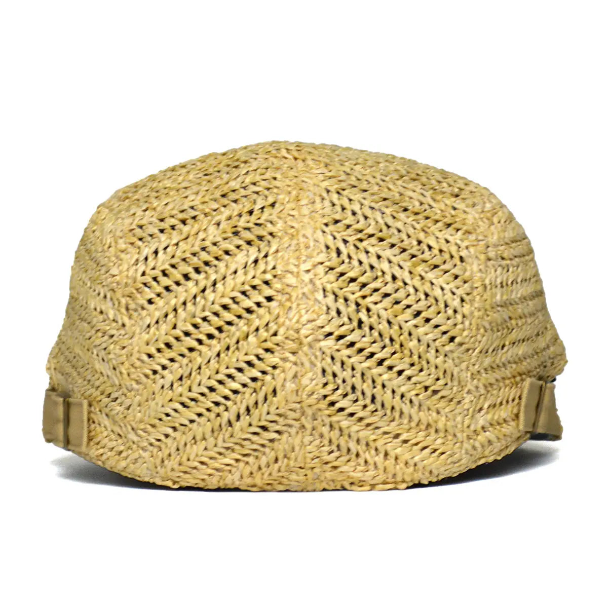 Un sombrero tipo cubo de paja tejida color beige claro con patrón de espiga y correas laterales ajustables, diseñado para la protección solar en verano.