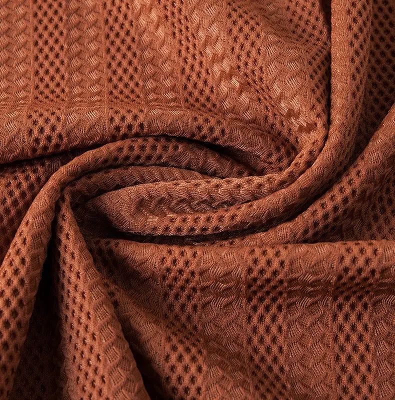 men’s textured ice silk contrast trim polo shirt fabric in brown with a woven pattern of small diamond-shaped holes and subtle wavy lines