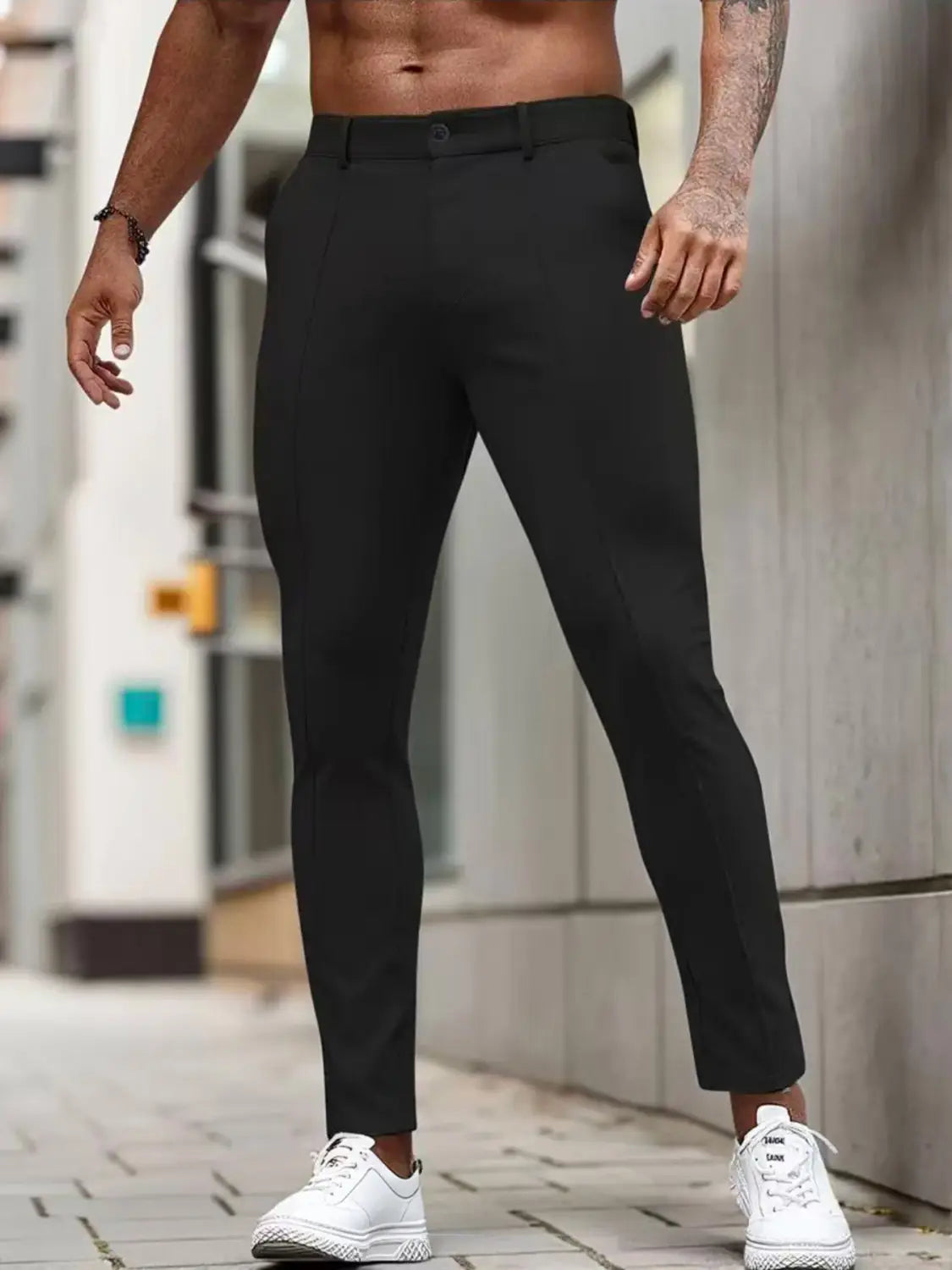 Herren-Slim-Fit-Stretch-Anzughosen in Schwarz mit elegantem, modernem Design und dezenten Stickdetails.