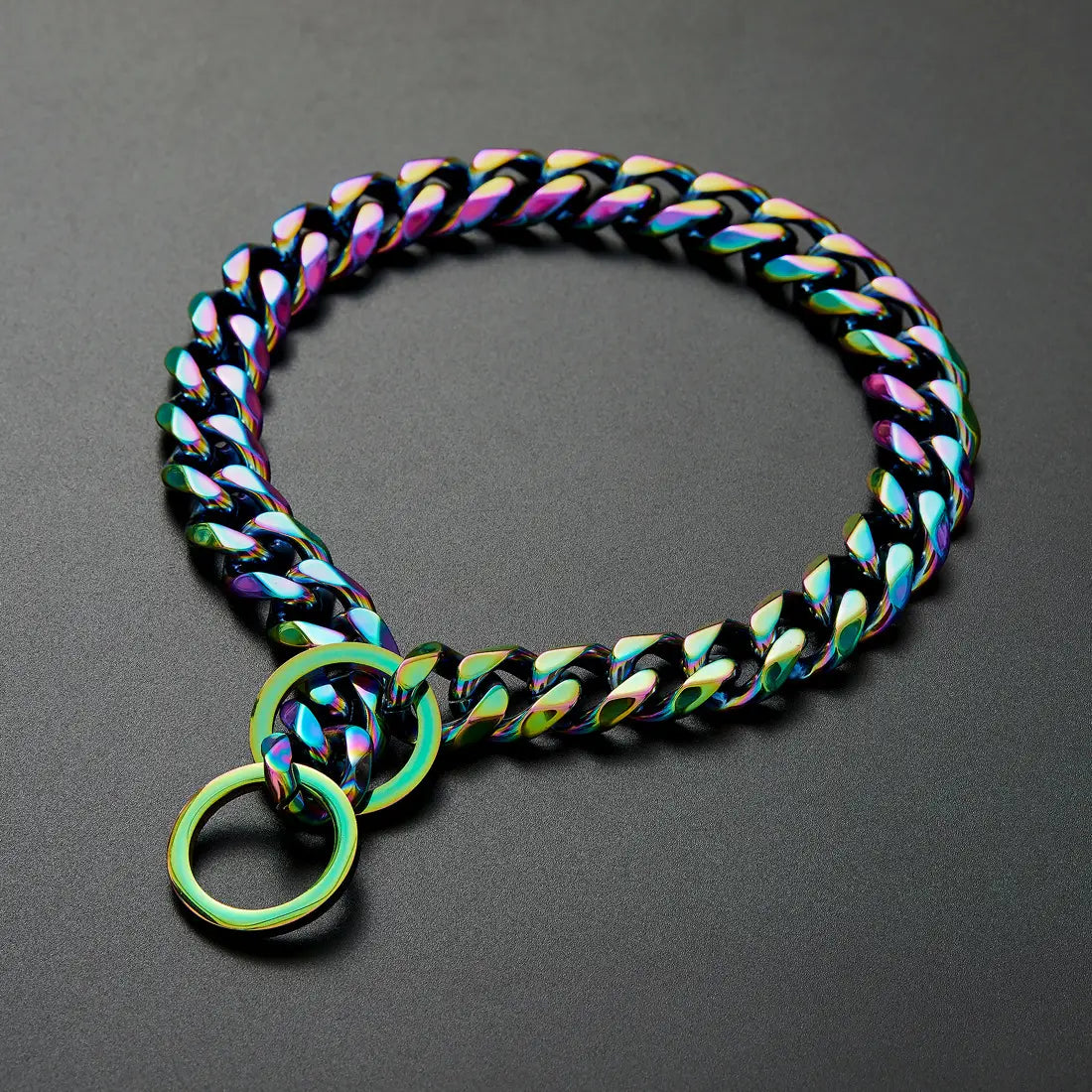 Rainbow stainless steel dog chain collar with an iridescent finish, bold chunky design, and dual circular rings.