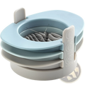 Light blue and gray plastic 3-in-1 egg slicer with rotating dial for slicing, halving, and wedge cutting
