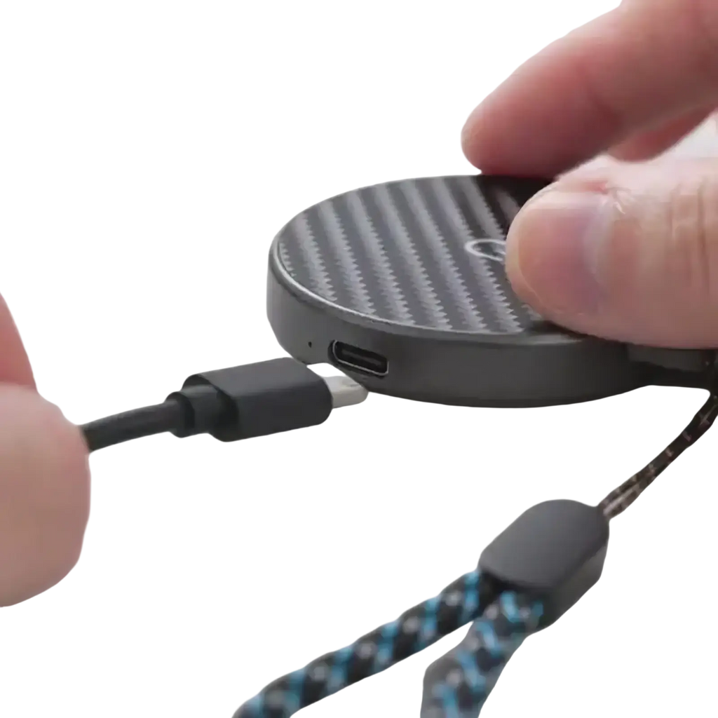 Black circular 3 in 1 magnetic wireless charging station with carbon fiber texture and braided blue black strap