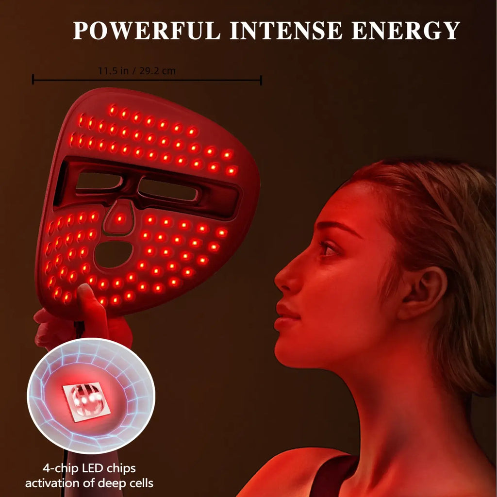 Red led facial mask with illuminated grid lights and cutouts for eyes nose and mouth for wireless light therapy