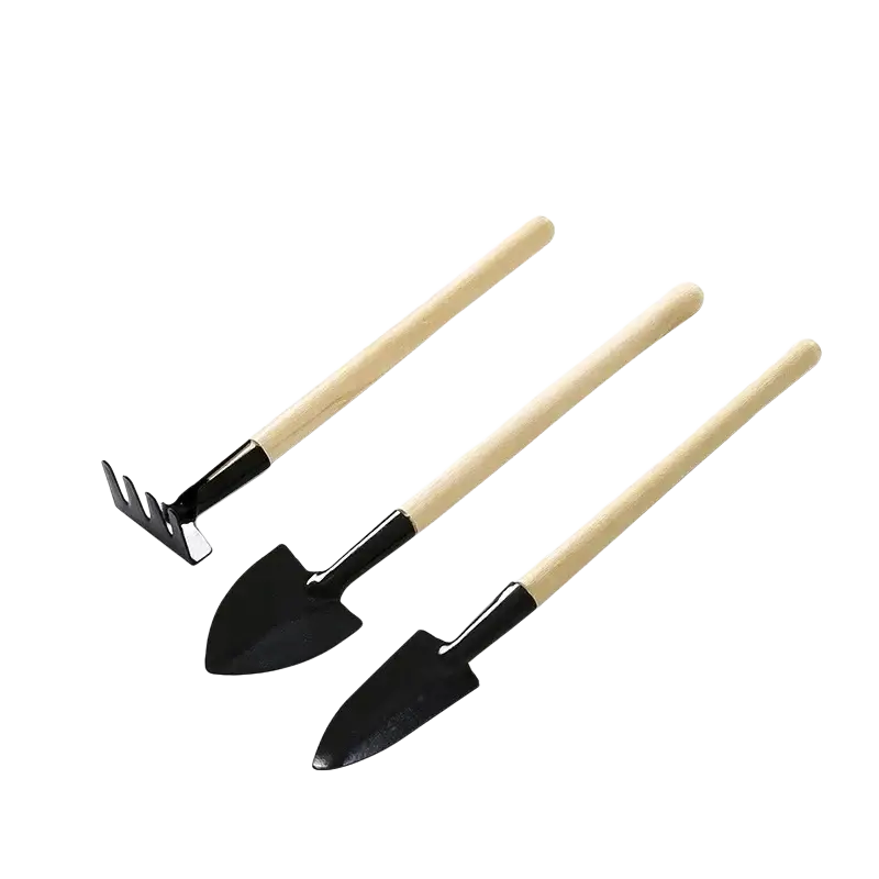 Set of three miniature garden tools with light wooden handles and black metal heads including trowel spade and rake