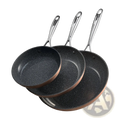 Set of three black speckled nonstick ceramic frying pans with copper rims and stainless steel handles for cooking