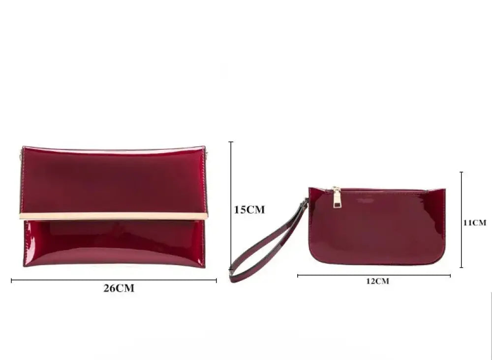 A glossy burgundy leather clutch with gold-tone clasp and matching wristlet from premium 3-piece crimson tote set