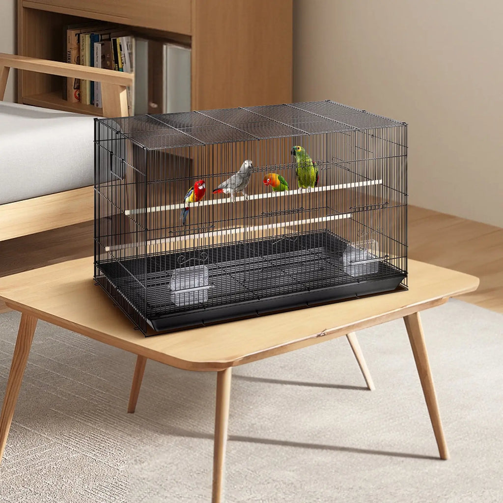 Black metal 30 inch bird flight cage with rolling stand housing colorful parrots on multiple perches and tray base