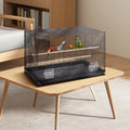 Black metal 30 inch bird flight cage with rolling stand housing colorful parrots on multiple perches and tray base