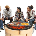 Black round steel grill grate with fire and food on it for 30 inch fire pit cooking mesh