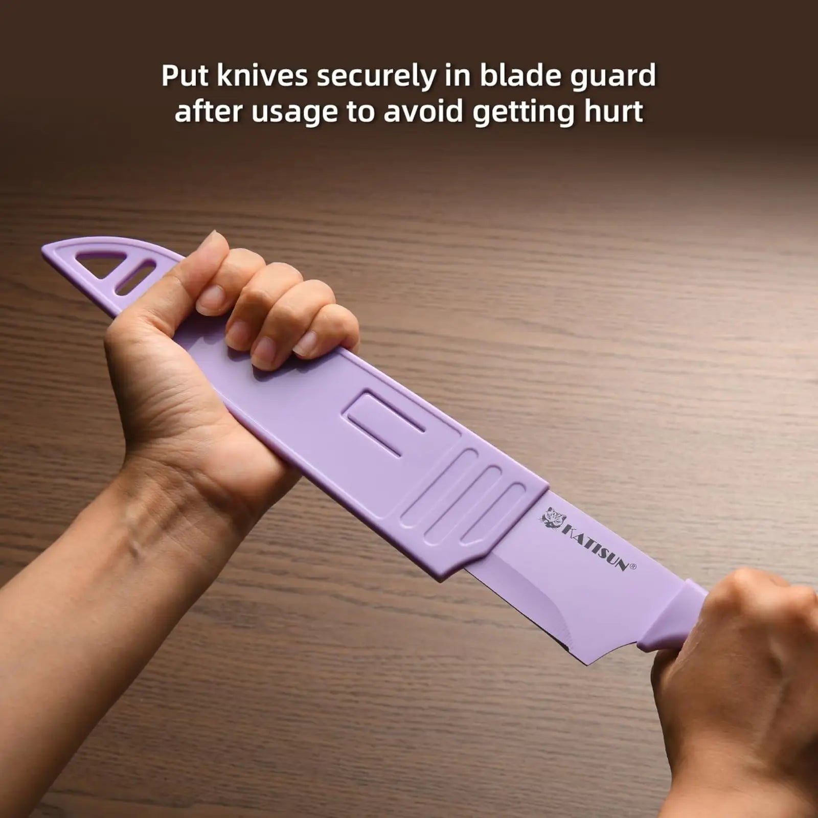 Purple plastic blade guard with molded grip slots and katisun logo for knife in 30 piece colorful knife set with cutting board