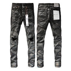 Men’s distressed slim fit patchwork denim jeans in black with a leather-look finish and ripped knees.