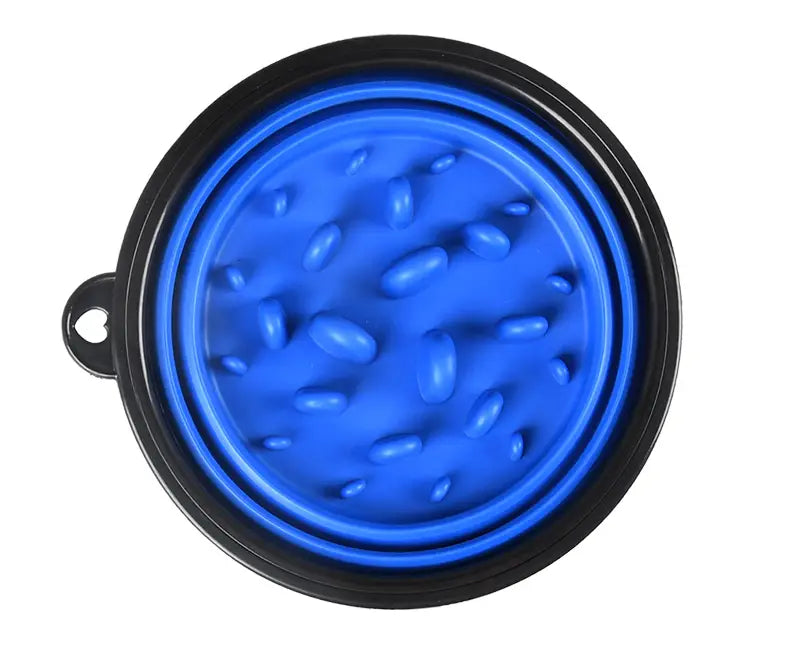 Bol pour animaux de compagnie pliable en silicone bleu, avec bord noir et surface texturée, conçu pour une alimentation pratique.