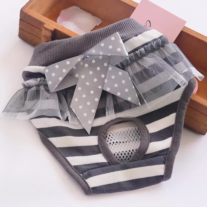 Gray and white striped dog physiological pants washable pet diaper with mesh ruffles and a polka-dotted bow for sanitary use.