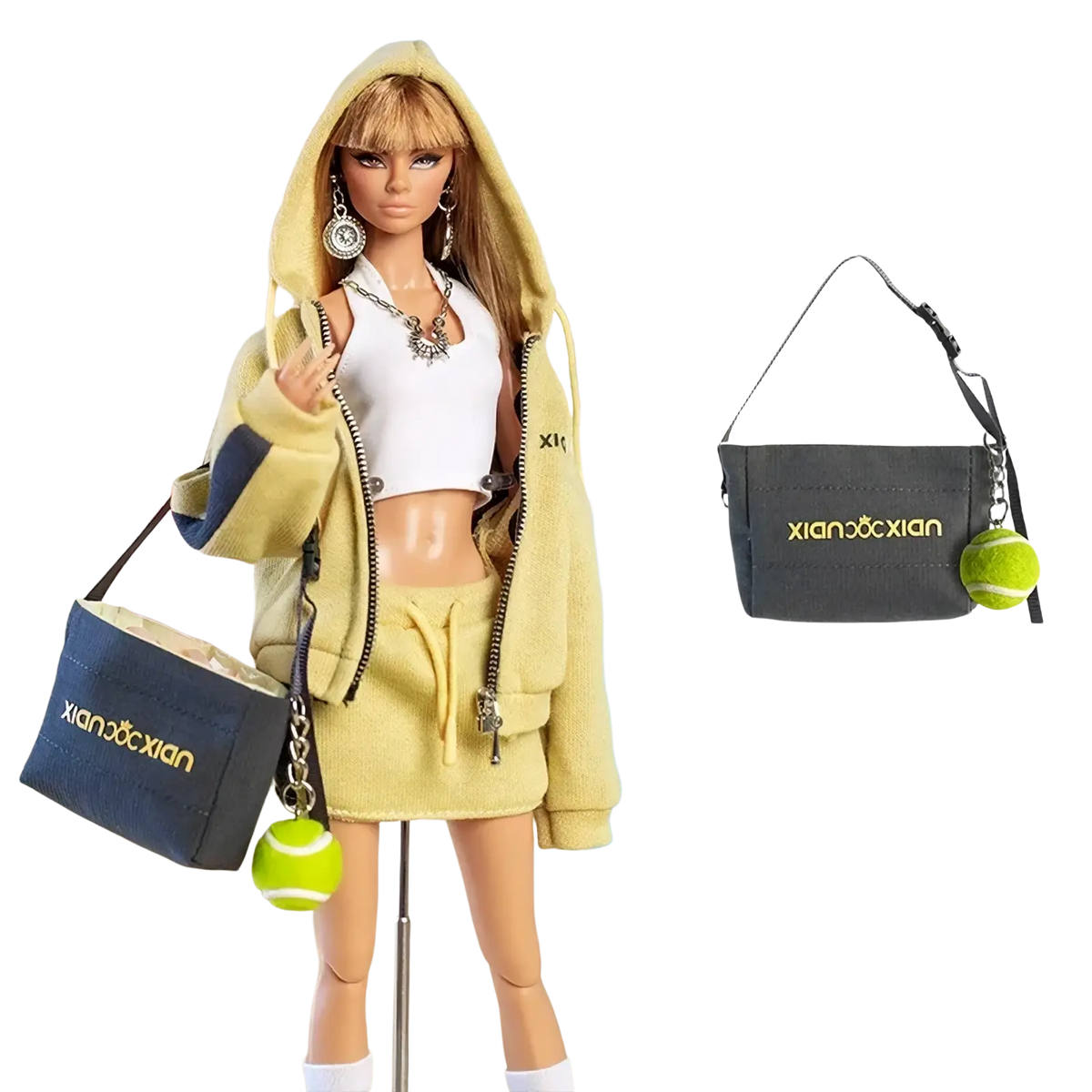 Dark gray fabric shoulder bag with gold embroidered branding and green tennis ball charm in 30cm doll sportswear set