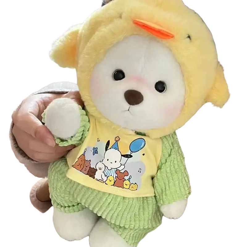 A 30cm nude bear plush dressed in a yellow duck hood, green corduroy pants, and a cartoon-print bib with manual measurement