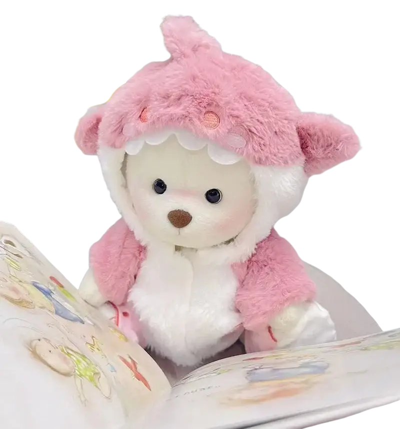A 30cm plush white nude bear wearing a pink fuzzy shark hooded outfit with scalloped edges and orange details