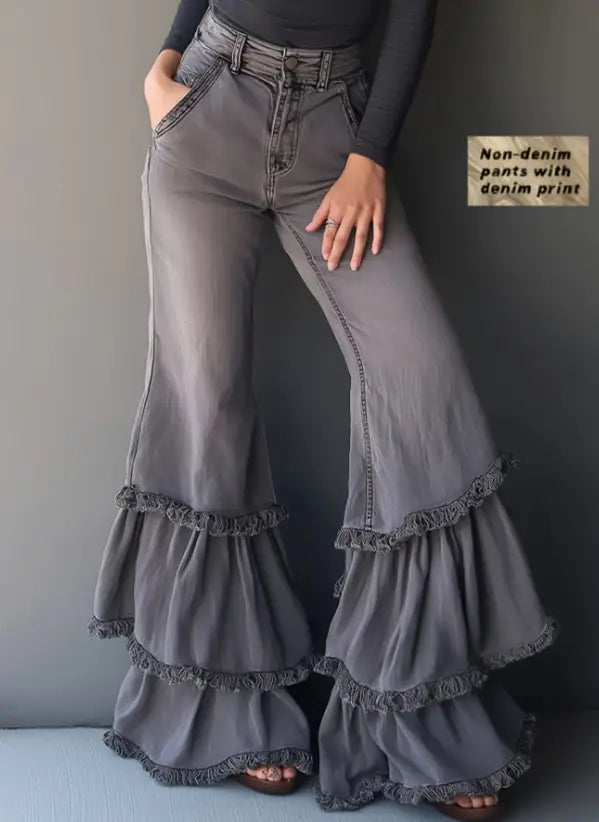 Gray denim print flared pants featuring layered ruffled hems for a stylish and unique look.