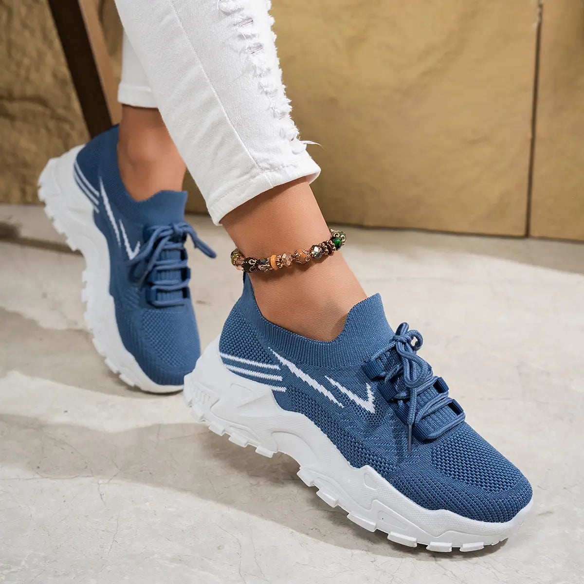 women’s lightweight breathable mesh lace up sports shoes in gray knit with chunky white sole and pink accents